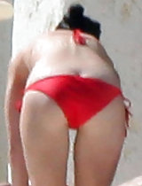 Katy Perry bent over and exposes her sweet ass while wearing a skimpy bikini in these pics