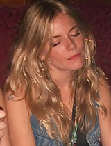Sienna Miller's pantyhose exposed in these upskirt pics