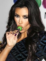 Kim Kardashian sucking a lollipop at some event in these pics