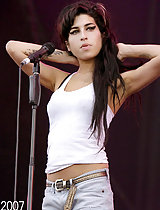 Amy Winehouse looking wasted and posing for the paps in her bikini