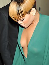 Rihanna's sweet juicy cleavage in a low-cut pantsuit in these pics