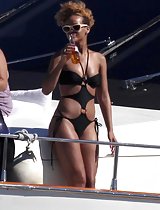 Rihanna's sweet juicy ass in a black bikini at the beach in these pics