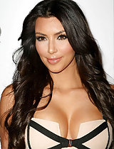 Kim Kardashian's juicy cleavage in a hot busty dress while promoting her latest perfume