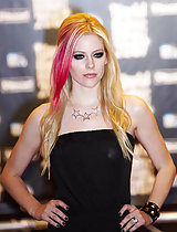 Avril Lavigne looking cute and sexy in a black dress in these pics