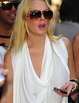 Lindsay Lohan leggy in white out in NY